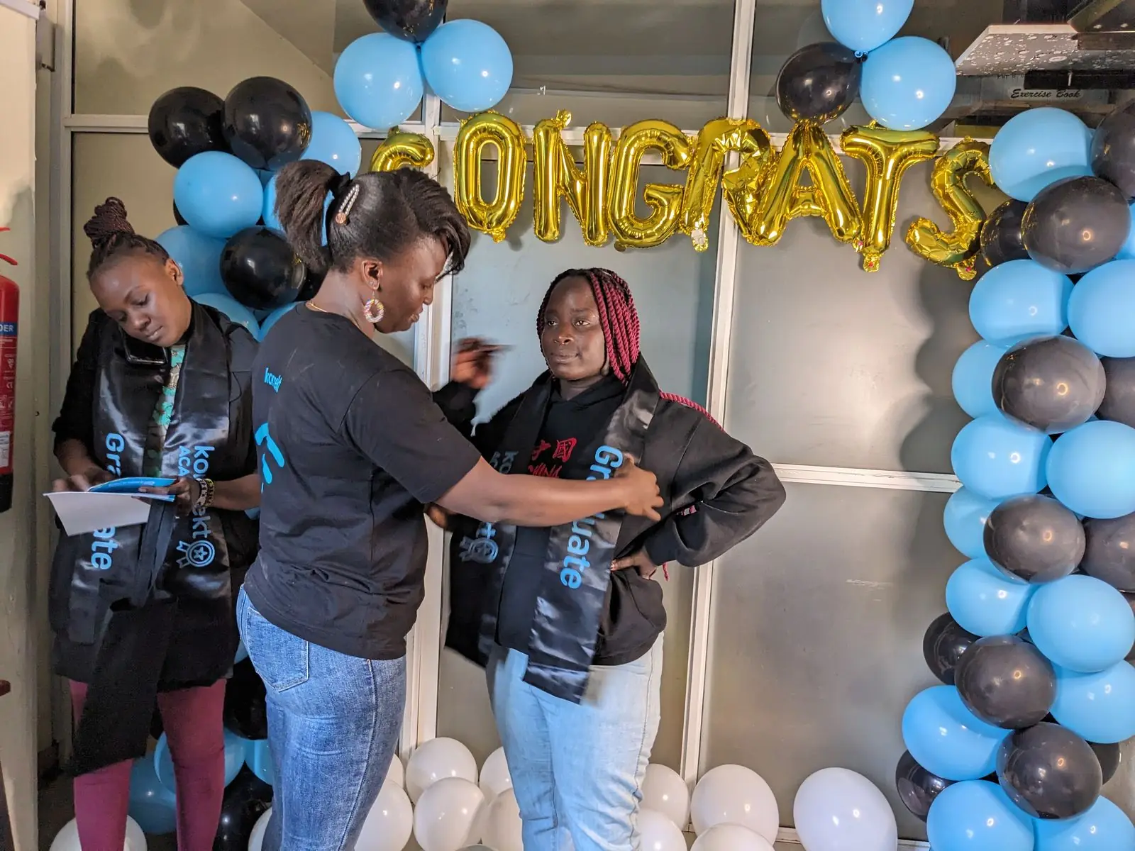 konnekt Academy graduates in sashes with konnekt staff