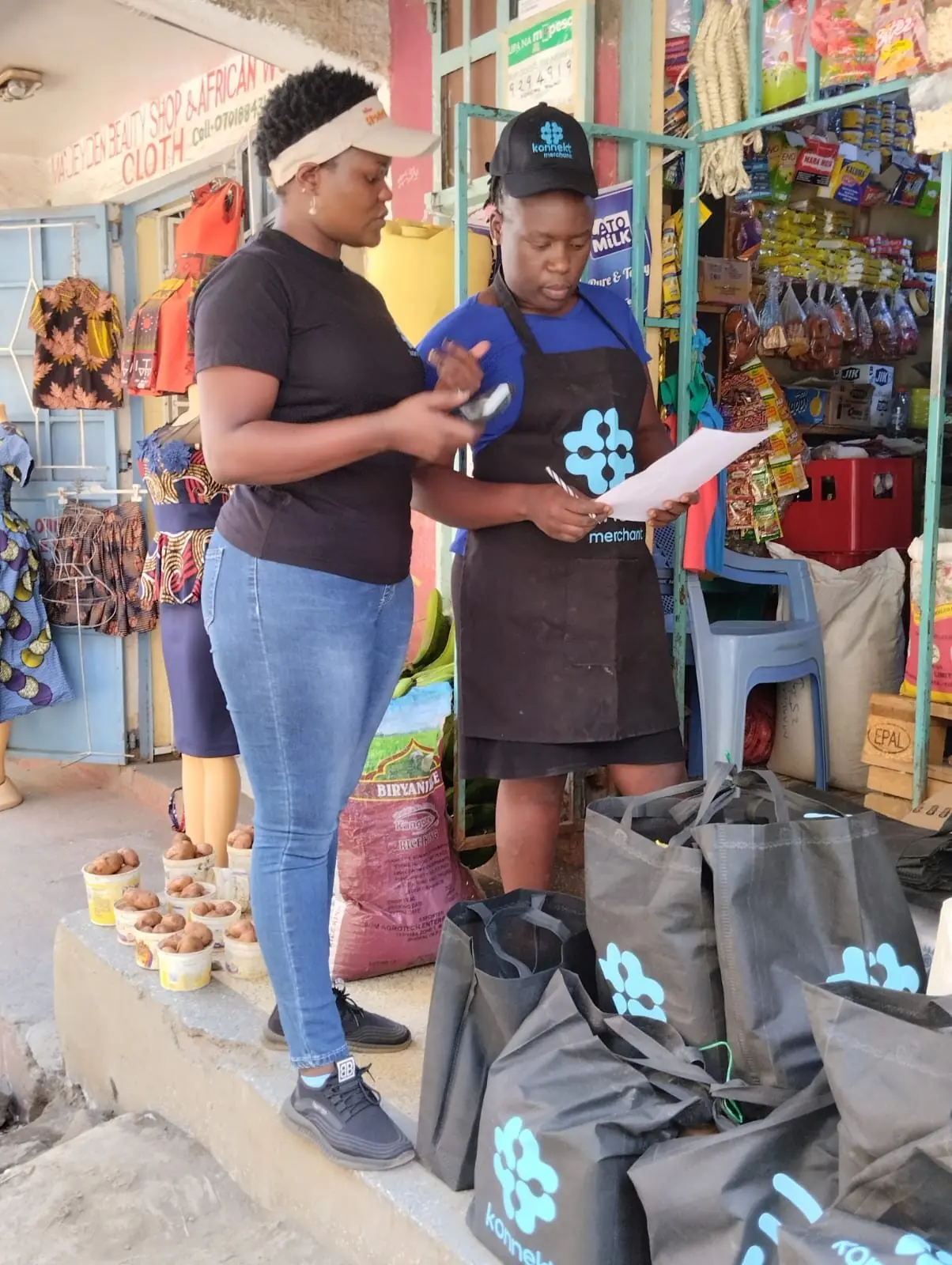 konnekt agents signing up customers at a market