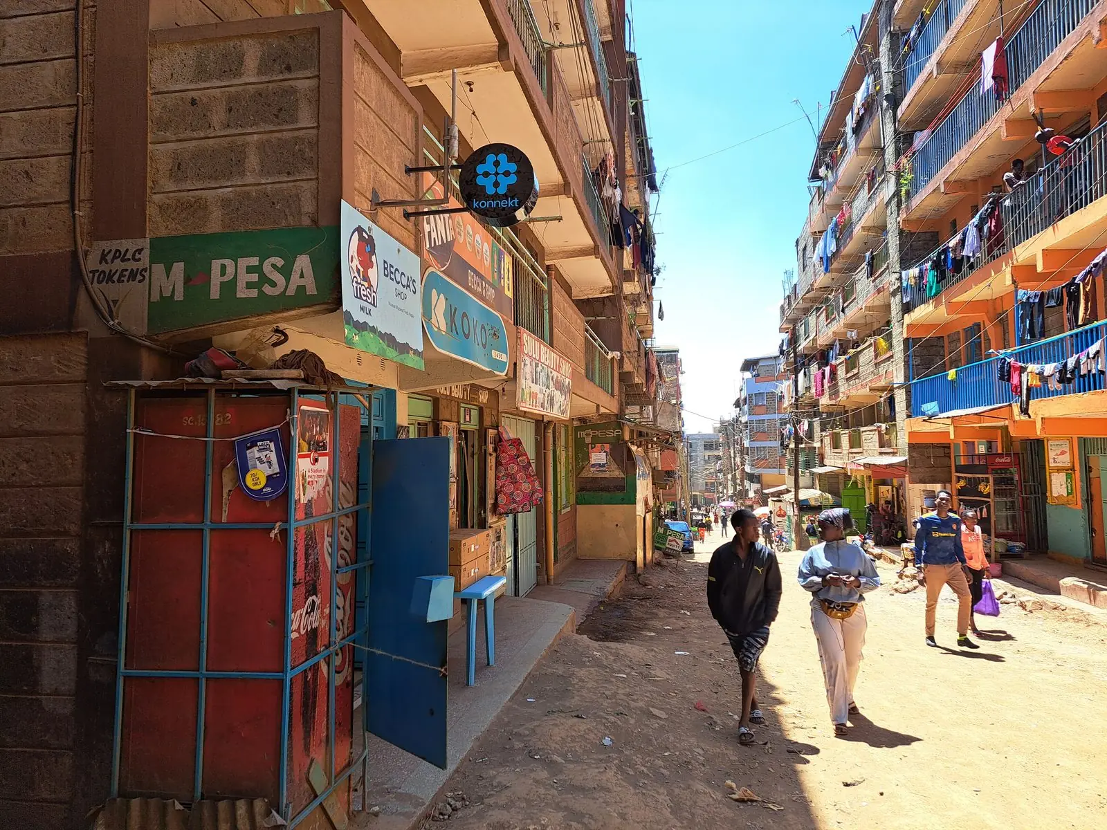 A street of neighbourhood shops with a konnekt partner sign