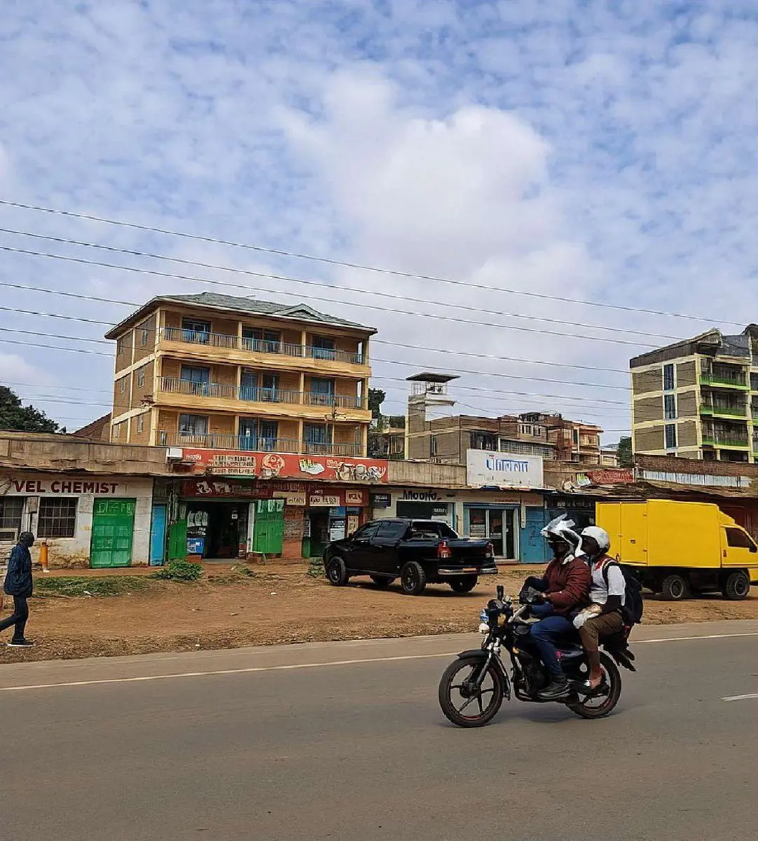 A Nairobi street lined with multi-storey apartment blocks